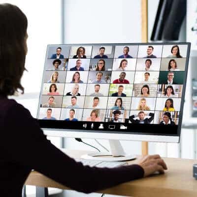 Employees engaging in a sleep hygiene educational corporate workshop virtually on their computers